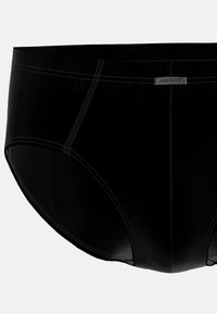 Slip da uomo neri caratterizzati da un tessuto morbido, un elastico in vita e dettagli di cucitura discreti. L'etichetta sulla vita identifica il marchio.