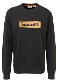 Felpa nera realizzata in misto cotone, con un logo arancione Timberland rettangolare centrato sul davanti e polsini e orlo a coste.