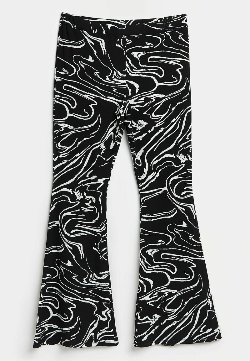 Leggings noirs avec un motif ondulé blanc. Fabriquées en tissu doux, présentant un design évasé au niveau des ouvertures des jambes. Ceinture élastique incluse.