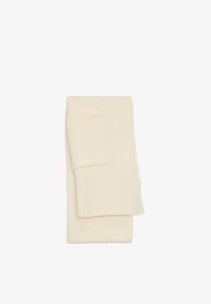 Kremowe skarpetki z prążkowanego materiału, starannie złożone, charakteryzujące się gładką fakturą i klasycznym wzorem bez widocznych wzorów ani ozdób.