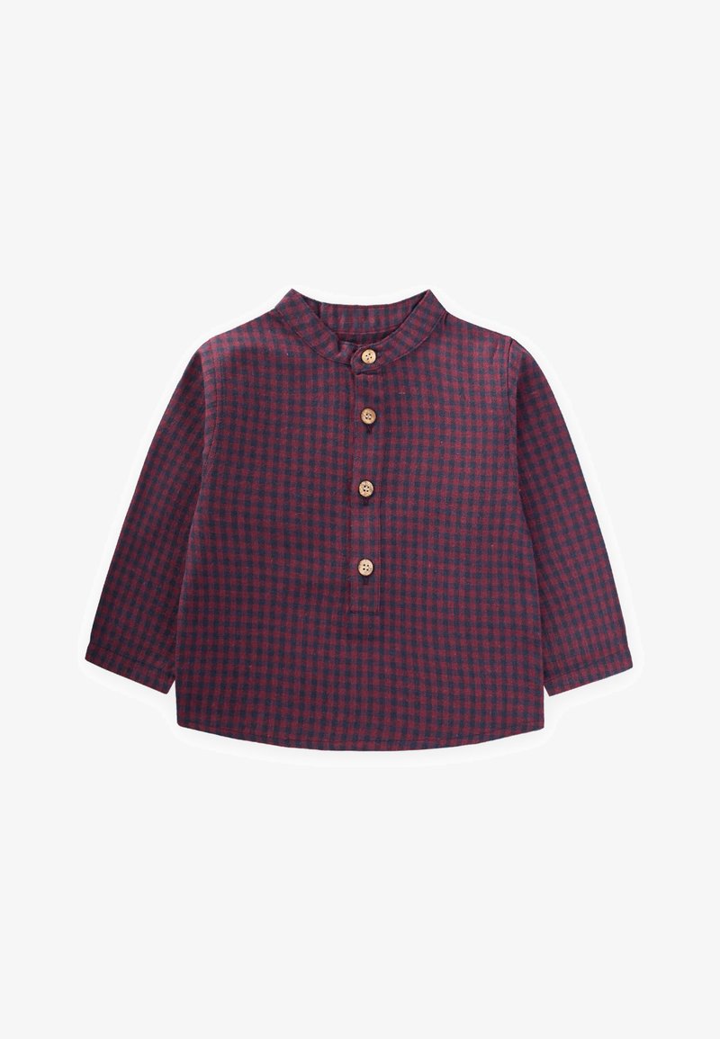 Camicia a quadri rossi e blu con colletto a bandiera, maniche lunghe e cinque bottoni in legno sul davanti. Tessuto morbido con una finitura texture.