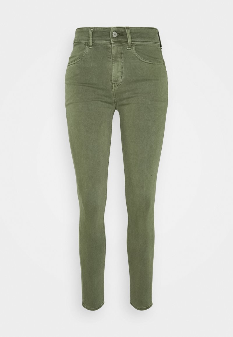 Jeans skinny fit en vert olive, dotés d'une taille haute, d'un design à cinq poches, d'une fermeture éclair et d'un détail en métal au niveau du bouton. Tissu lisse et extensible.