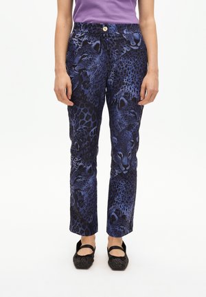 Blue patterned trousers featuring a leopard print, made from a smooth material, with a button closure and straight-leg design.