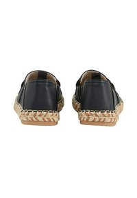 Navy leather slip-on shoes with a woven jute sole and contrasting tan stitching. Features elastic side panels for easy wear.