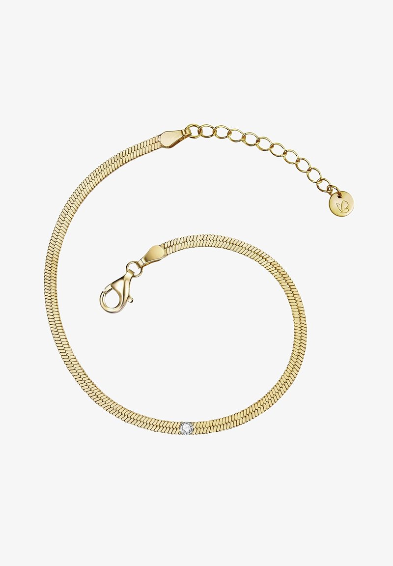 Bracelet en métal doré avec un design en mailles flexibles, doté d'un fermoir à homard et d'un petit accent en pierre précieuse claire. Chaîne ajustable avec un charm délicat.