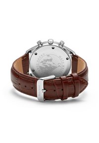 Chronograph watch with a silver stainless steel case, brown leather strap featuring crocodile texture, and engraved case back with logo.