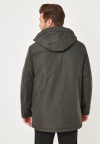 Dark gray hooded jacket with a textured fabric, long sleeves, and a relaxed fit, featuring a hidden front zipper and back seam detailing.