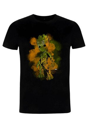 Black t-shirt featuring a green animated character with large eyes, surrounded by orange and green smoke effects, and "GUARDIANS OF THE GALAXY" text.