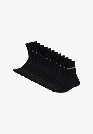 Calzini di cotone neri in confezione da dieci, con parte superiore a coste e logo ricamato. Forma uniforme con una texture liscia e un design leggero.