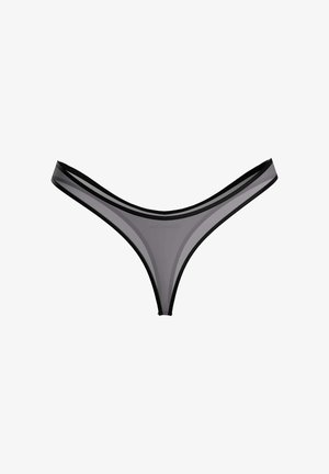 Tanga en maille transparente noire pour femme, avec taille fine et coutures, sur fond blanc.