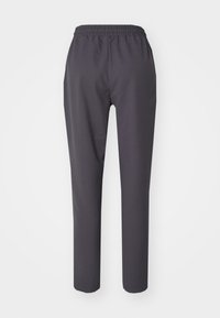 Pantalons sombres gris avec taille élastique et coupe droite, fabriqués en tissu lisse. Caractéristiques d'un style minimaliste sans motifs visibles.