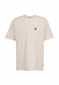 T-shirt in cotone color crema con scollatura rotonda, maniche corte e un piccolo dettaglio ricamato sul lato sinistro del petto.