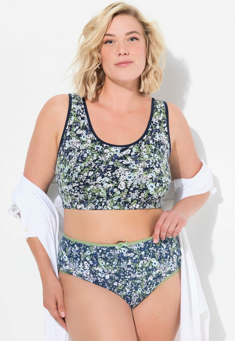 Top corto a fiori e slip a vita alta in navy, verde e bianco, con bordi in contrasto. Materiale morbido e design aderente.