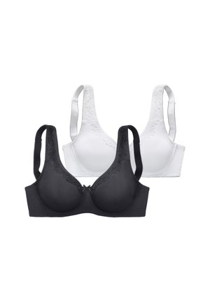 Two lace-trimmed bras, one black and one white, with full coverage cups and adjustable straps on a plain white background.