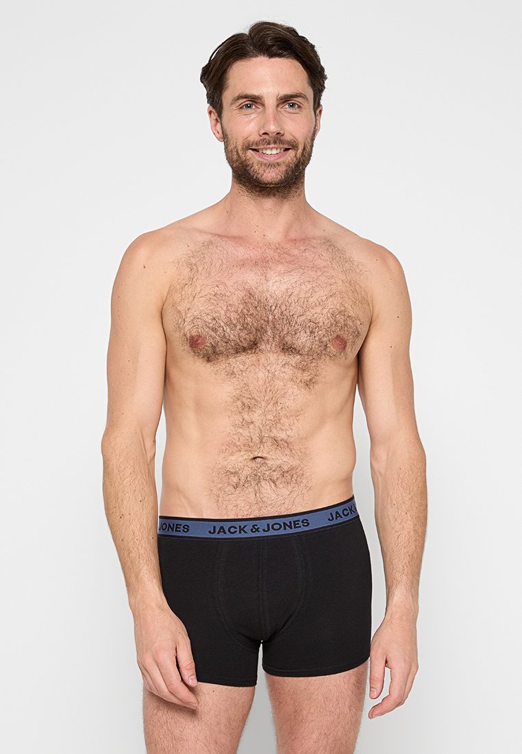 Boxer shorts negros con una cinturilla azul que presenta el logotipo "JACK & JONES". Tejido suave, ajuste ceñido, adecuados para uso casual.