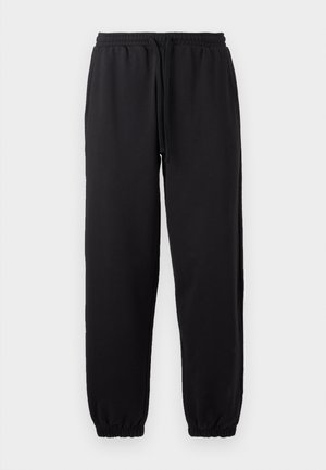Pantaloni da jogging neri realizzati in tessuto morbido, con vita elasticizzata e cordino regolabile, e orli a costina.