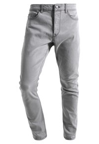 Jeans skinny in denim grigio con un design a cinque tasche, passanti per cintura e chiusura frontale con bottone. Texture liscia con cuciture sottili.