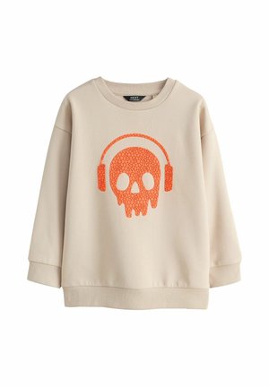 Beiger Pullover mit orangefarbenem, rissigem Totenkopf mit Kopfhörern auf der Vorderseite, langen Ärmeln, gerippten Bündchen und Saum.