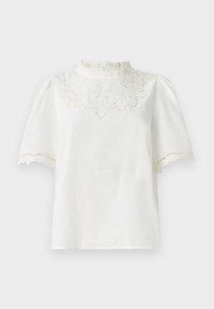 Valge lühikeste varrukatega pluus kõrge pitskraega, millel on keerukas lilleline tikand ja laineline äär. Pluus on valmistatud kerge kangaga.