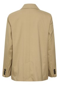 Blazer beige vu de dos, avec une couture droite au centre, un col à revers cranté et des boutons foncés aux poignets des manches.