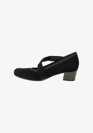 Chaussure noire en daim de style Mary Jane avec un bout arrondi, une sangle croisée et un faible talon carré, présentant une texture lisse et des détails de couture subtils.
