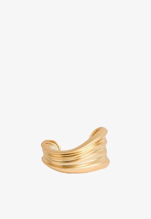 Wide gold cuff bracelet with smooth, layered ridges and an open back, displayed on a white background.