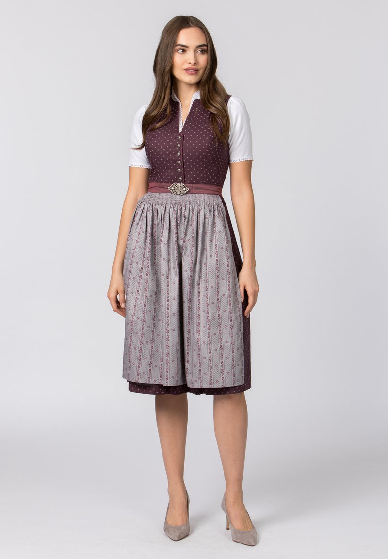 Traditional dress with a fitted maroon polka dot bodice, white sleeves, and a gray skirt featuring floral patterns. Includes a decorative belt.