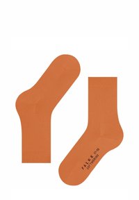 Orange Crew-Socken aus weichem Material, mit einer glatten Textur und einem gerippten Bündchen. Markenname und Größe auf der Sohle gedruckt.