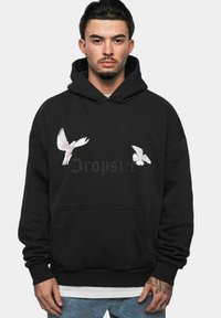 Black hoodie with a front pocket, featuring two white bird graphics and the text "Dropsie" in dark grey. Soft fabric; relaxed fit.