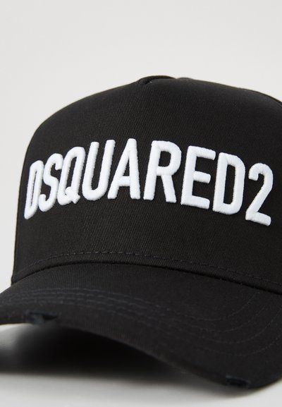 Black baseball cap made of fabric featuring white embroidered "DSQUARED2" logo on the front, with a traditional curved brim.