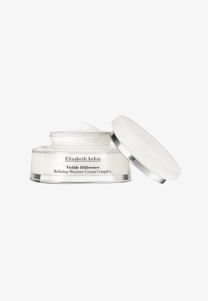 Round, clear glass jar with a white cream and silver accent lid. Label reads "Elizabeth Arden Visible Difference Refining Moisture Cream Complex."