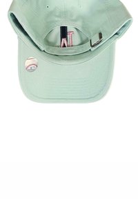 Light mint green baseball cap made of cotton fabric, featuring a curved brim, embroidered logo, and a circular baseball-themed tag.