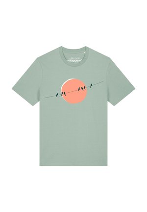 Light green short-sleeve t-shirt with a graphic of five birds sitting on a wire against a large peach-colored circle background.