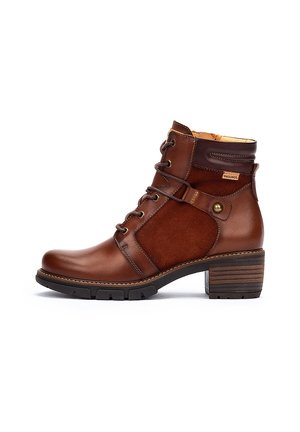 Brown leather ankle boot with a textured suede panel, lace-up front, decorative strap, and a chunky wooden heel.