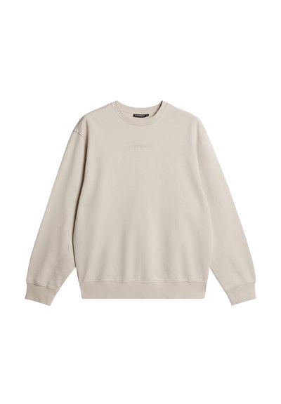 Beige sweatshirt med rund hals, lange ærmer og ribbede manchetter. Har et subtilt logo i midten. Glat tekstur og afslappet design.