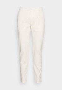 Off-white smala bomullbyxor med bältesöglor, framknapp, dragkedjestängning och sidofickor mot en ljusgrå bakgrund.