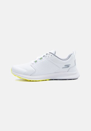 White athletic sneaker with gray accents, mesh upper, logo on heel, lace closure, and yellow-treaded sole on a plain background.