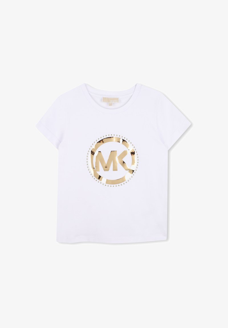 T-shirt blanc à manches courtes avec logo MK métallique doré à l'intérieur d'un cercle, orné de petits clous dorés autour du logo.