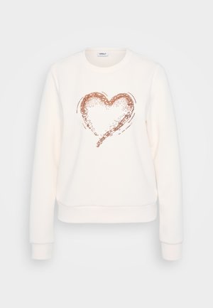 Fehér pulóver, elől rózsaarany flitterezett szívmintával, kerek nyakkal, bordázott mandzsettával és hem.
