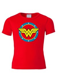 Red children’s t-shirt made of cotton, featuring a large yellow and black "W" logo with wings inside a circular blue and yellow design.