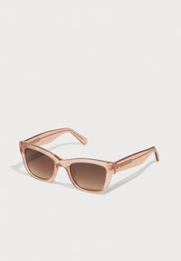 Rose-tinted sunglasses with a transparent plastic frame and brown gradient lenses. Square shape; temple arms with subtle sparkles.
