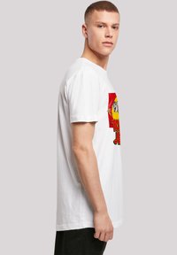White cotton t-shirt featuring a colorful cartoon graphic on the front. Short sleeves and a relaxed fit with a straight hem.