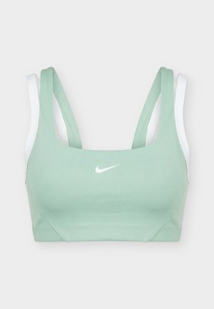 Világoszöld és fehér Nike sportmelltartó dupla vállpántokkal és középen fehér Nike swoosh logóval az elején.