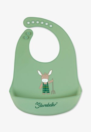 Silicone bib in soft green with a rounded neck. Features a printed donkey character holding a pitchfork, and a catch-all pocket at the bottom.