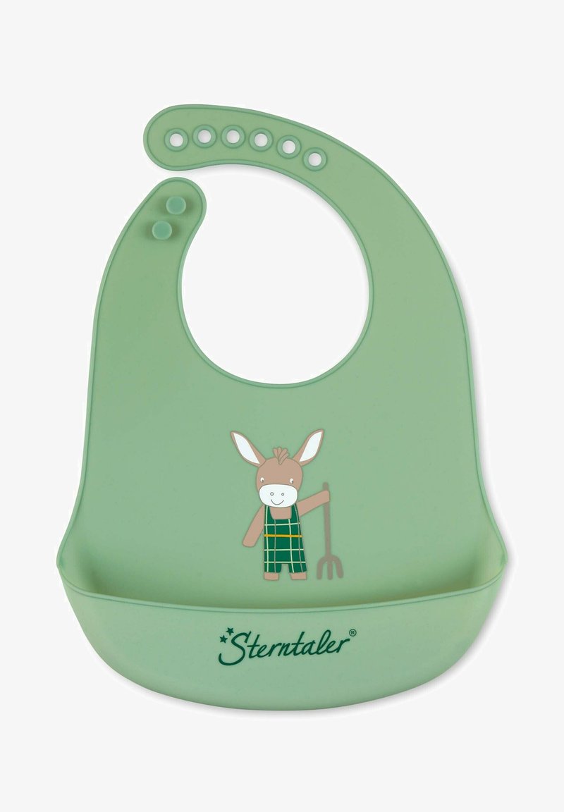 Silicone bib in soft green with a rounded neck. Features a printed donkey character holding a pitchfork, and a catch-all pocket at the bottom.