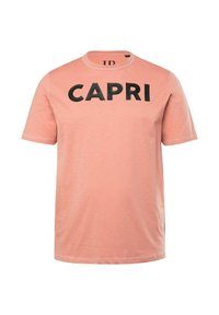 Kortærmet t-shirt i lyserød bomuld med en rund halsudskæring og fed sort "CAPRI" tekst hen over brystet.