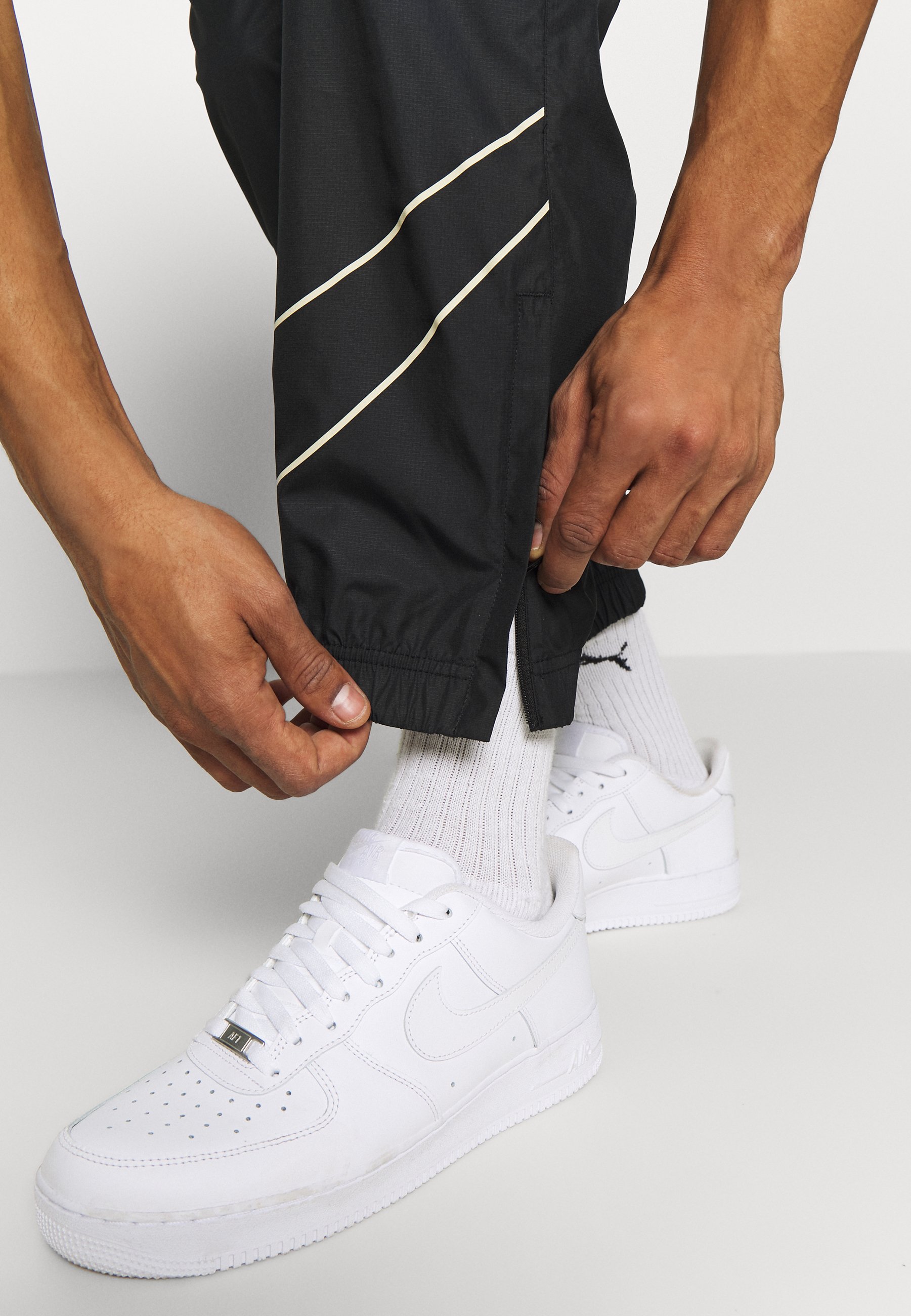 nike fossil & black track pants