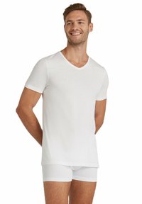 White short-sleeve V-neck t-shirt made from soft fabric, paired with white boxer briefs; lightweight, smooth texture, and simple design.