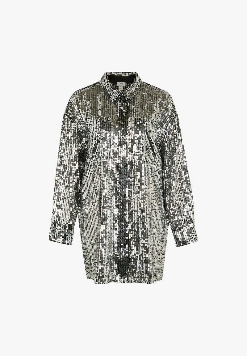 Chemise argentée à sequins avec manches longues, col et coupe ample. Présente une texture entièrement pailletée avec un motif vertical.