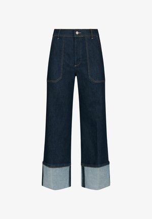 Tumši zili platleği denim bikses ar kontrastējošiem gaiši ziliem uzmaviem, ar priekšējiem kabatām un pogu aizdari.
